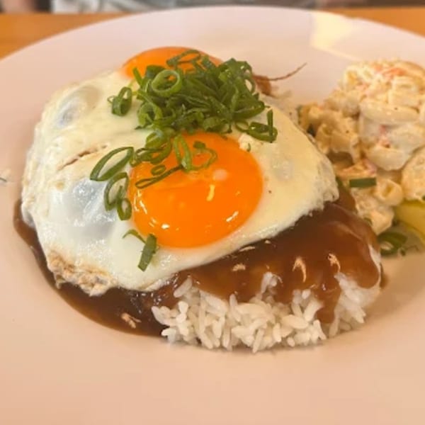 Hana Hou Restaurant's Loco Moco with two fried eggs, gravy, rice, and macaroni salad.